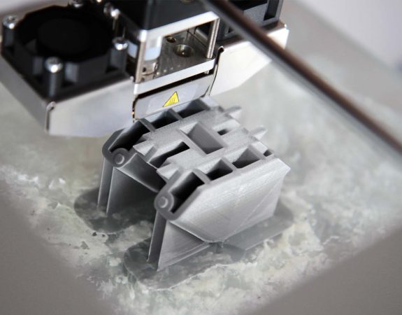 What is the difference between 3D printing and rapid prototyping?