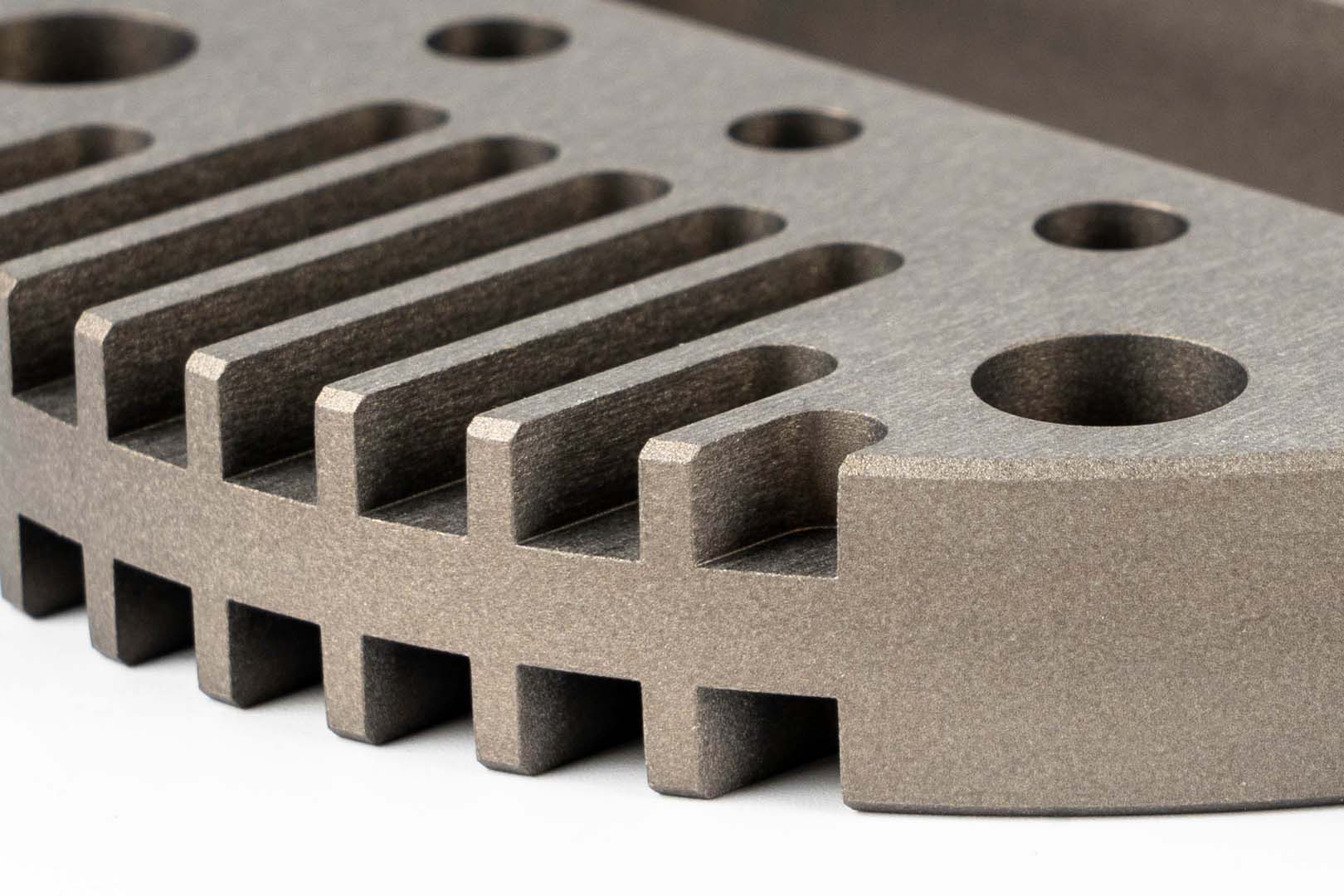 aluminium workpiece with a brown anodised finish