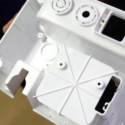 insert molded part with threaded inserts