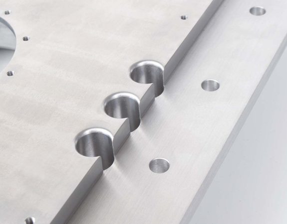 cnc machined aluminium workpiece with a clear anodised surface finish